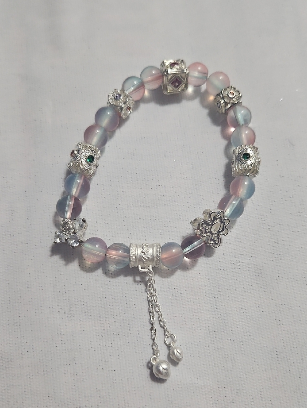 ​Whimsical Pastel Aurora Borealis Beaded Bracelet with Silver Charms & Tassel